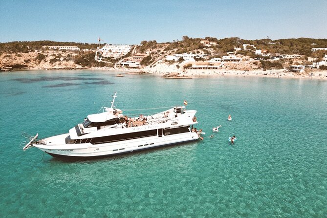 5 Hour Adults Ibiza Boat Trip + lunch, 6 drinks, SUP Boards & DJ - Cala Bassa brings the best swimming break