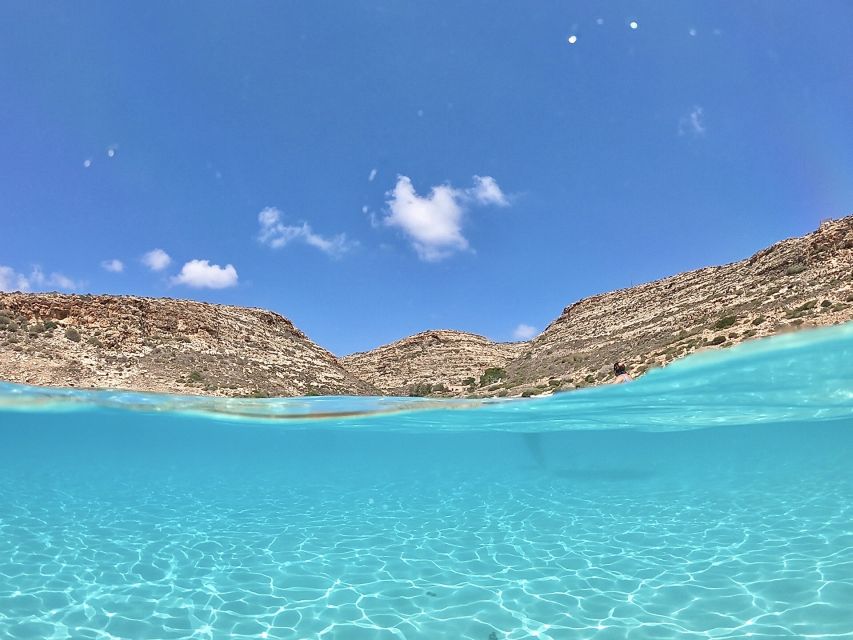5 hours Lampedusa: Boat Tour with panino SUP e snorkeling - Snorkeling in clear Mediterranean water