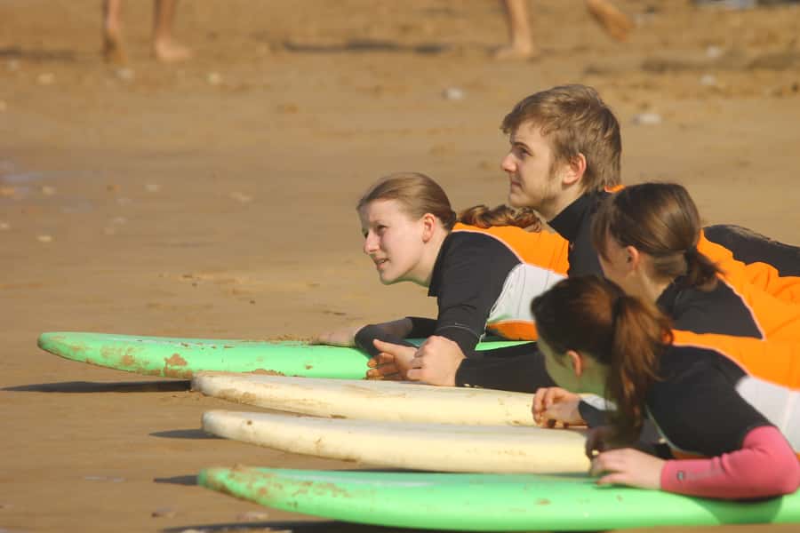 Agadir: Taghazout Beach Surf Lesson with Lunch and Transfer - Equipment, instruction, and group size