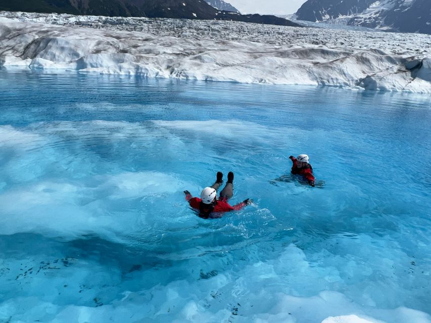 Anchorage: Knik Glacier Helicopter and Paddleboarding Tour - Learning to paddle among the ice