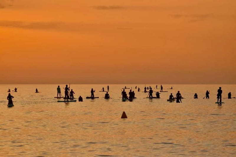 Barcelona: Paddleboarding at Sunrise. Includes: instructor, photos, equipment - Paddling out for the sunrise