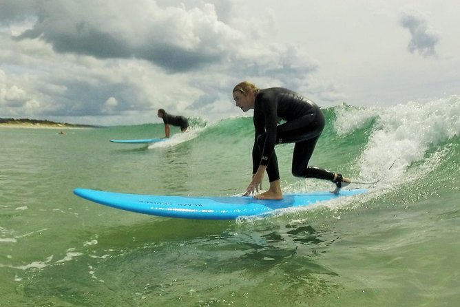 Beginner Surf Lesson at Te Arai Beach - Learning the pop-up before the water