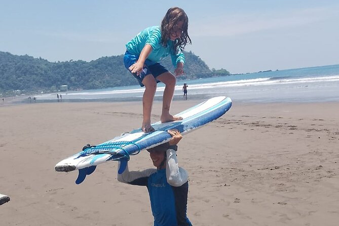 Conquer the Ocean with Surf Masters- Surf Lessons for all Levels - Catching waves in the Pacific