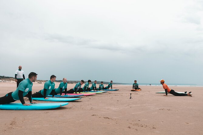 Dedicated Surf Experiences in Costa da Caparica, near Lisbon - A yoga warm-up before the surf drills