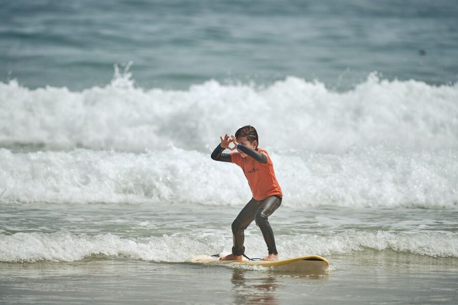 Family/children surf lesson - The First 20 Minutes: Warm-Up and Beach Instruction