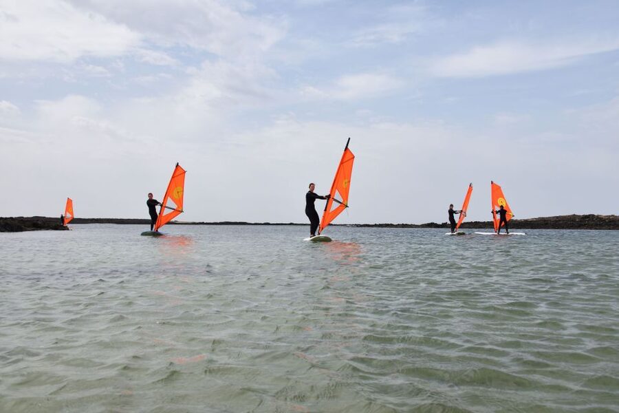 From Corralejo: Small Group Windsurfing Class in El Cotillo - Land practice: learning the board and sail