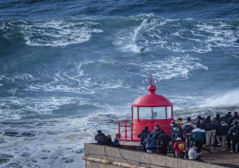 From Lisbon: Nazaré – Portugal’s Giant Waves Surf Tour - Nossa Senhora da Nazaré and the seven-skirt tradition