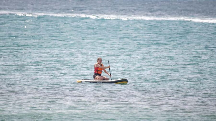 Fuerteventura: Explore Costa Calma Bay on a SUP Board! - Getting the board through the shore break
