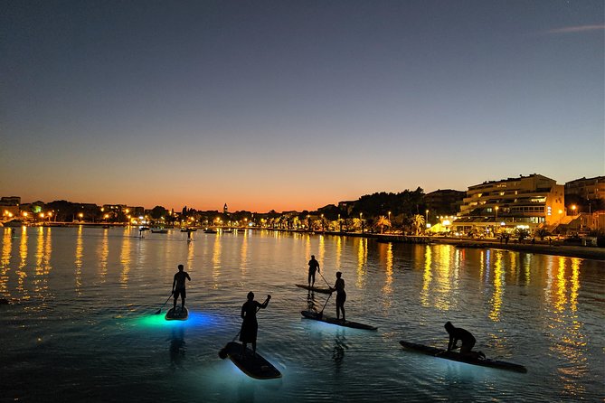 Glowing Stand-Up Paddle Experience in Split - Back to the sea, with rocks and old houses