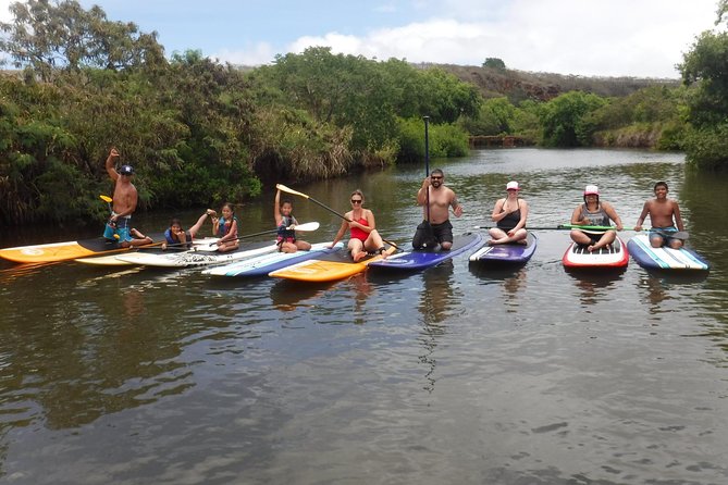 Group Stand Up Paddle Lesson and Tour - Learning to stand up before heading upriver