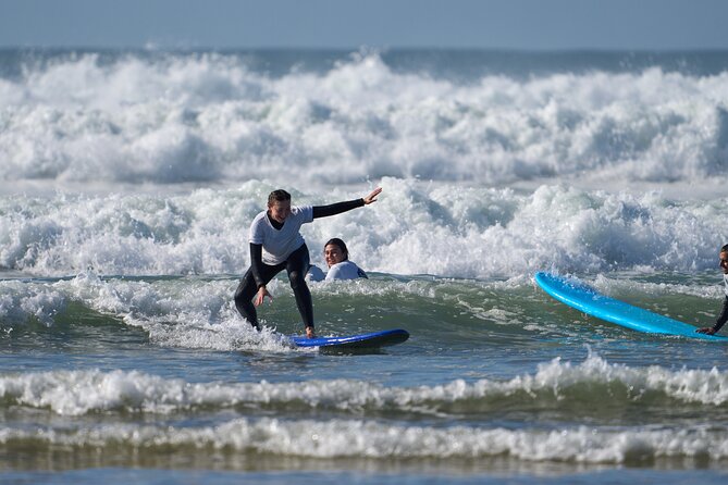 Group Surf Lesson in Costa da Caparica - Moving into the water to catch your first waves