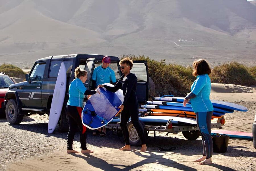 Group surf lessons in Lanzarote, learn with a local team - Meeting Momo Surf School on the beach