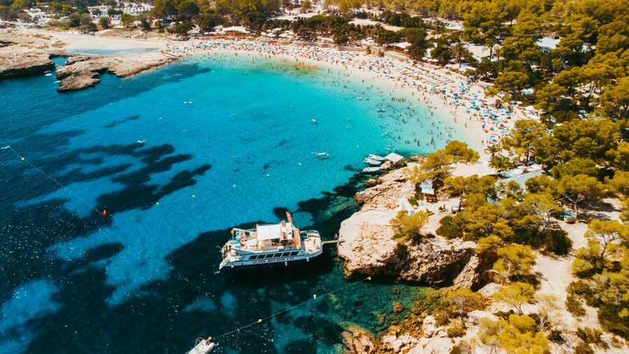 Ibiza: Beach Hopping Cruise w/ Paddleboard, Food, & Drinks - Music, sunset, and the return to San Antonio