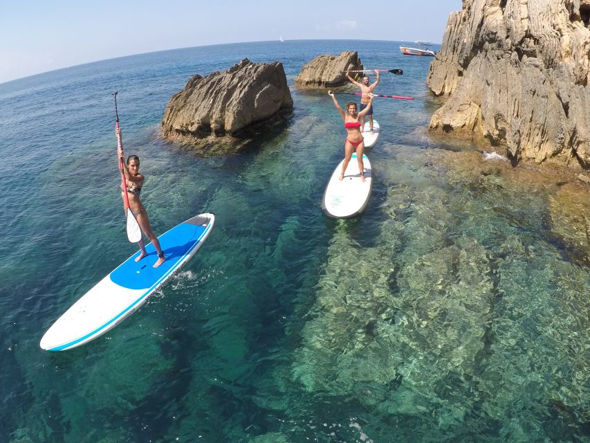 Ibiza: SUP & Snorkel Boat Tour with Caves, Drinks & Photos - Learning SUP before reaching the coves