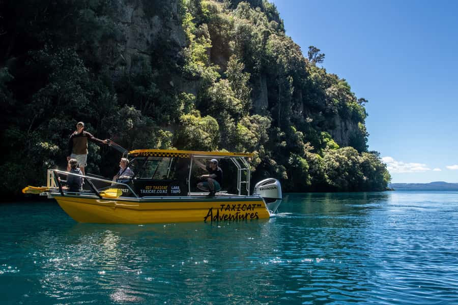 Kinloch: Lake Taupo Catamaran Cruise with Paddleboarding - The first 90 minutes: cliffs, forest, and volcanic rock