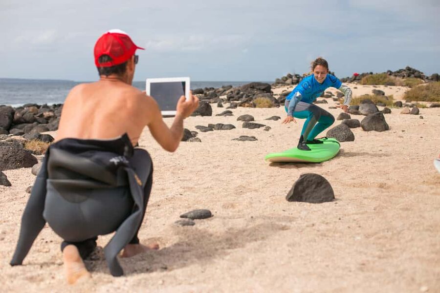 Lanzarote: Famara Private Surf Lesson with a real Pro - Walking to a quieter spot in Famara
