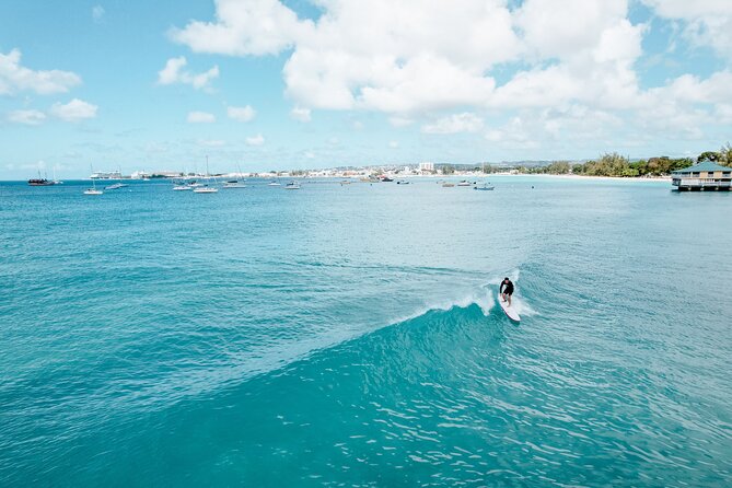 Learn to Surf in Paradise. - From beach briefing to first wave