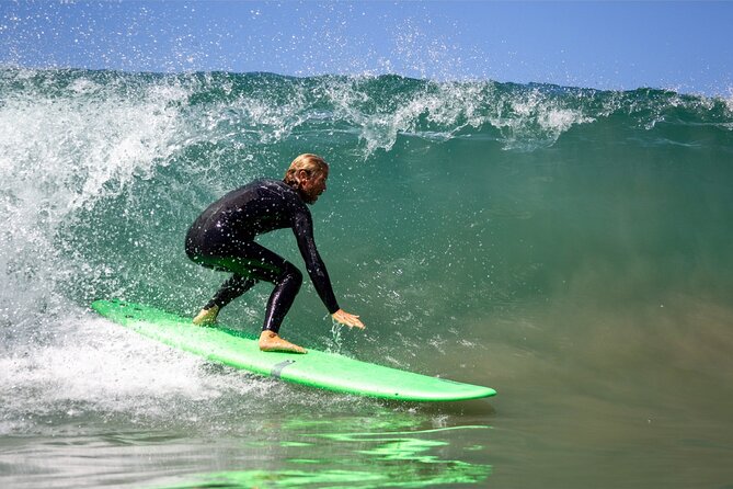 Leucadia Beach Surf Lessons - Paddling out with Karch