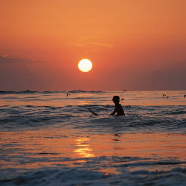 Lisbon: Sunset Surf Experience - Getting fitted with a board, wetsuit, and lycra