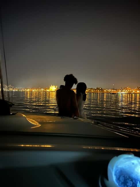 Majorca: Dinner aboard a private catamaran with snorkeling and paddle surfing - A short sail to the dinner cove