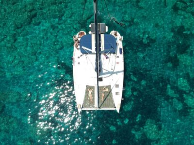Milos: Full-Day Catamaran Cruise with Paddle Board
