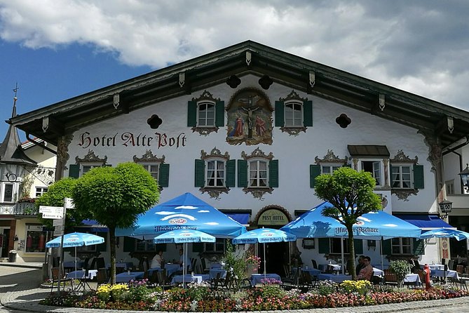 Munich private Car & Walking Tour incl. BMW World & River Surfers - An Alpine Lake Lunch in Austria
