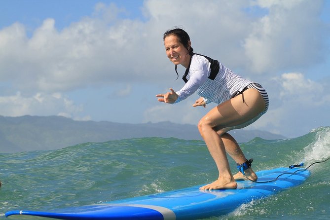 Oahu Private Surfing Lesson - Surfing with the included board and rash guard