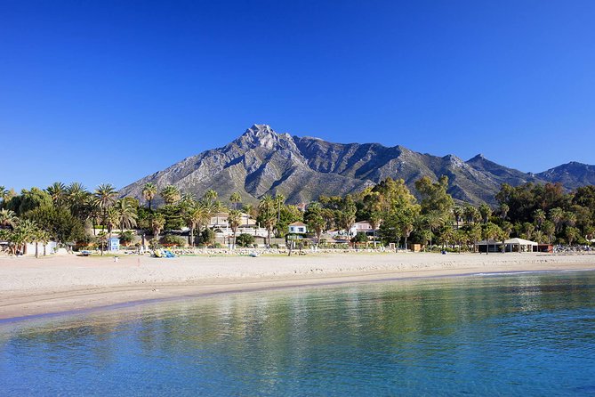Paddle Boarding Tour on the beautiful Marbella Coast - Getting upright on the SUP board