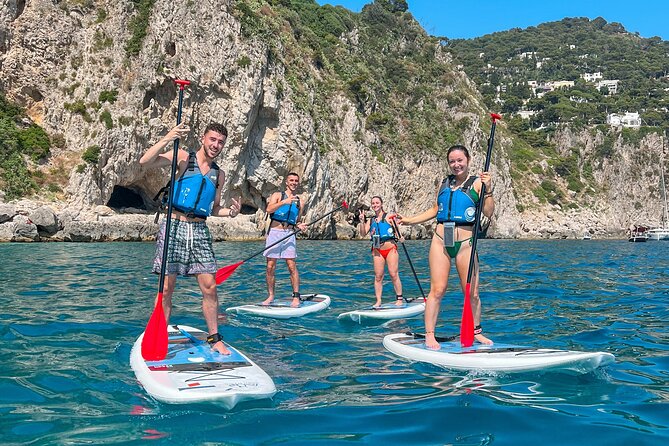 Paddleboard in Capri between caves and beaches. Photos included! - Swimming beside Capri’s cliffs