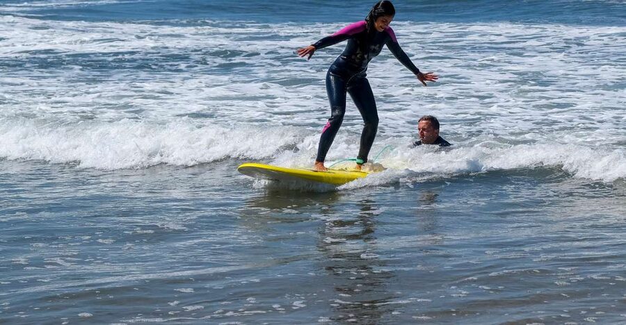 Porto: Small Group Surfing Experience with Transportation - Getting fitted for the board and wetsuit