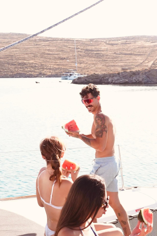 Private Catamaran Cruise Mykonos Delos with Meals & SUP - Rhenia cove time: swim, snorkel, or use the SUP
