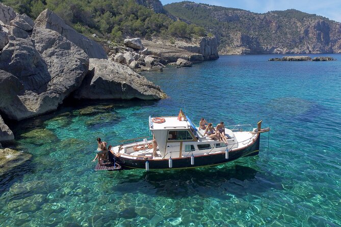 Private Mediterranean classic boat with Paddle boards+Snorkelling - Leaving San Antonio on a private classic boat