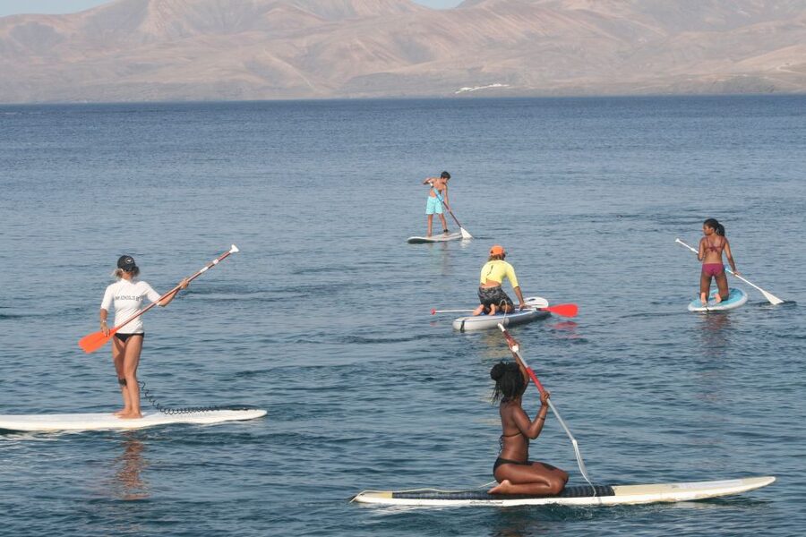 Puerto del Carmen: Stand Up Paddleboarding Class - Starting beside the stored paddleboards in Puerto del Carmen