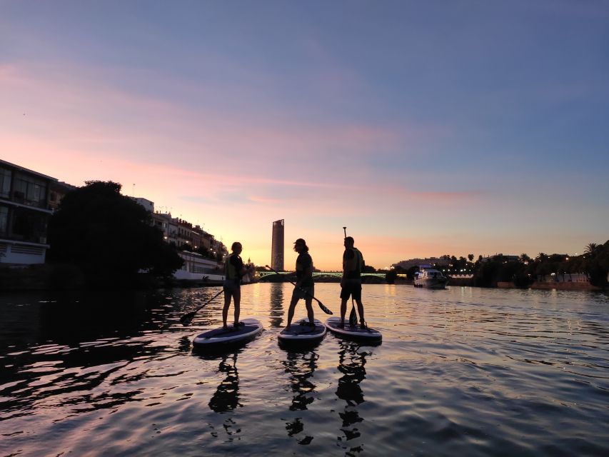 Seville: Sunset and Evening Paddle Boarding Tour - Getting comfortable on the board in Triana