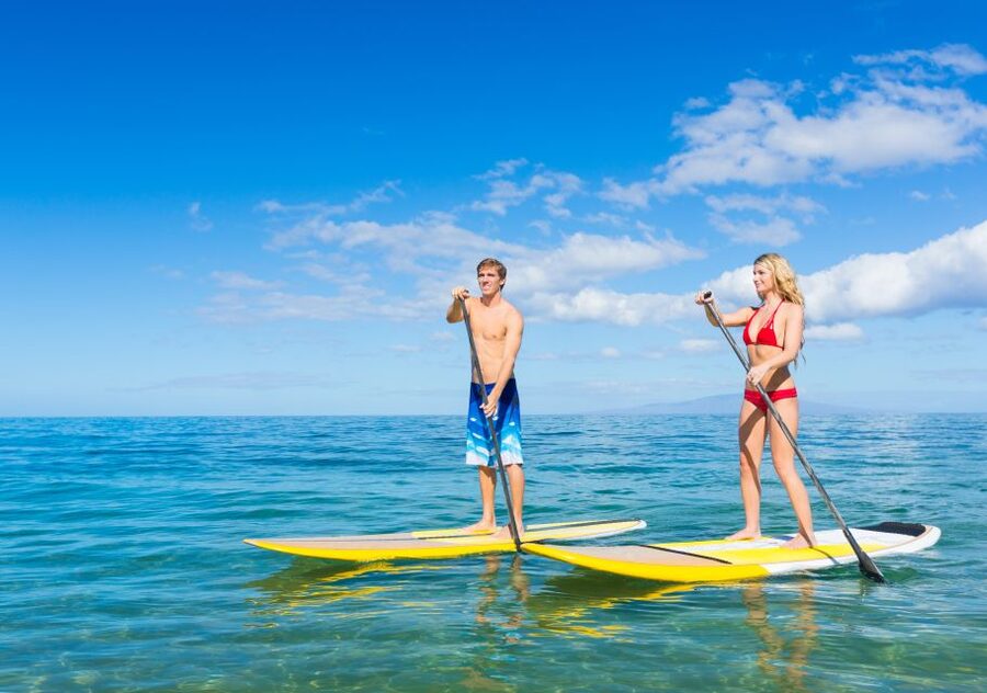 South Maui: Makena Bay Stand-Up Paddle Tour - Learning to stand up on the board