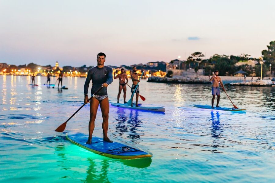 Split: Stand Up Paddleboard Night Glow Tour - The sea section: white rocks, cliffs, and evening calm