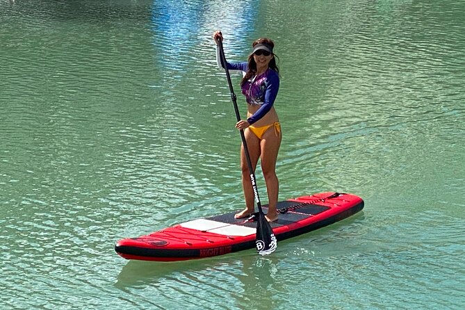 Stand Up Paddle Board Lessons - Learning to stand near Kaimana Beach