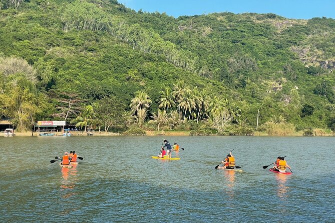 Stand Up Paddle Boarding and Sunset Watching on Cai River - Paddling through farmland and quiet river scenery