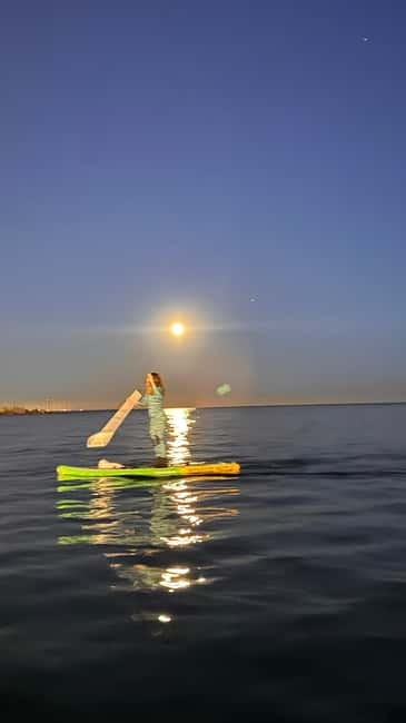 Sunset+paddle surf with music+fotos&videos Barceloneta+snack - A sunset view of Barcelona from the water
