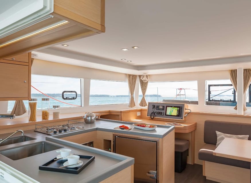 SUP Safari - Catamaran Cruise Dia Island & Gourmet Delights! - The catamaran as your floating lunch room