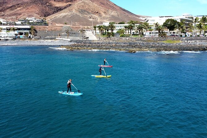 SUP Standup Paddling and Snorkeling Shared Experience - Learning to stand on the board with a small group