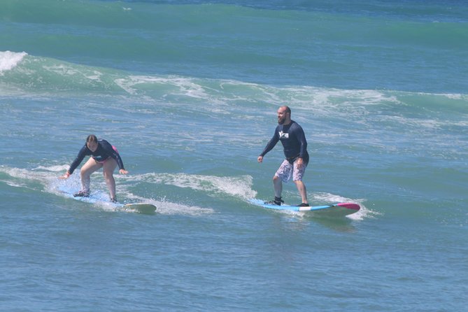 Surf HNL: Small-Group or Private Surfing Lesson (Ko'olina) - Surfing gear is included, but pack your beach essentials