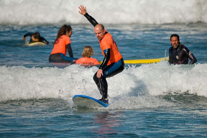 Surf in Tenerife – Photos Included & Stand Up From Day One - Getting fitted with a board and wetsuit