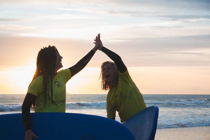 Surf Lesson on Praia de Carcavelos - Taking the first board into the Atlantic