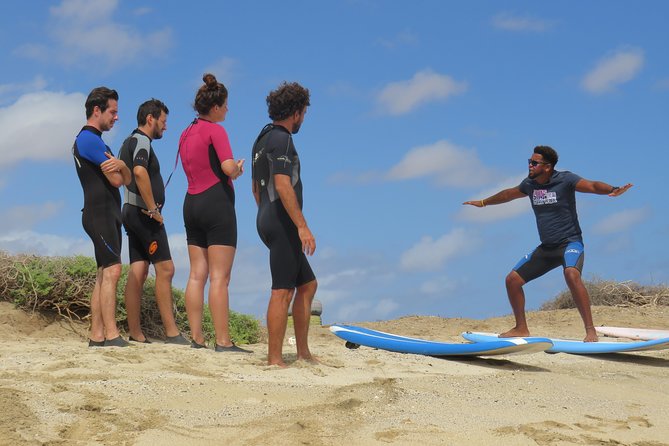 Surf Lessons - Board, Wetsuit, and Surf Shoes Included