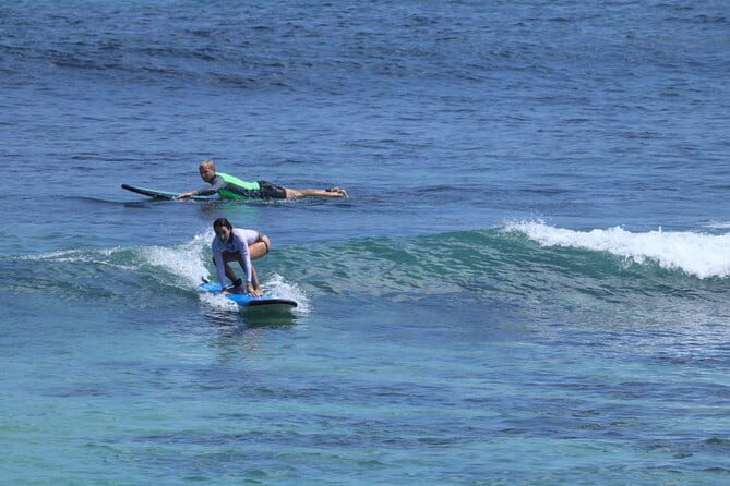 Surfnesia Surf Lesson and Guiding - Paddling, popping up, and catching a wave