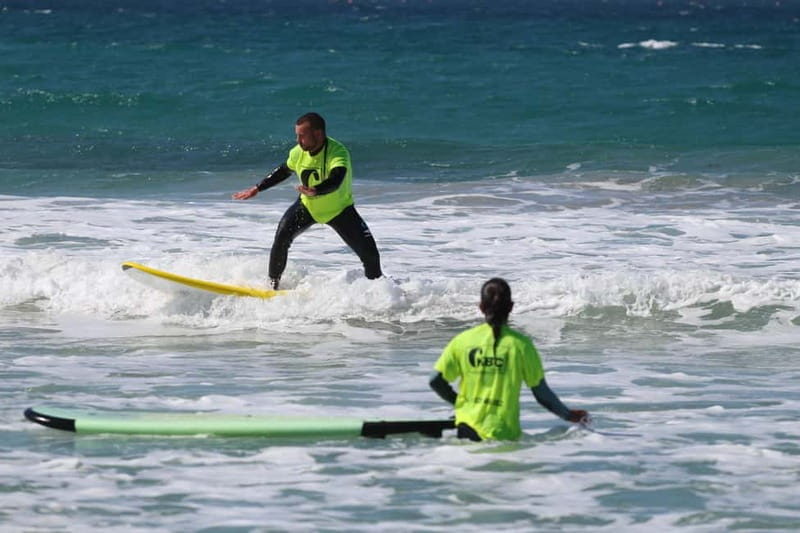 Tarifa: Group Surf Classes - Starting with Safety, Warm-Up, and Surf Basics
