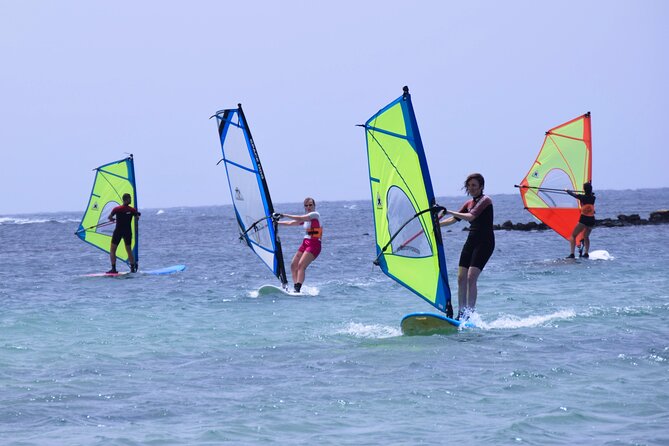 Windsurf classes in Fuerteventura - Preparing the board, sail, wetsuit, and boots